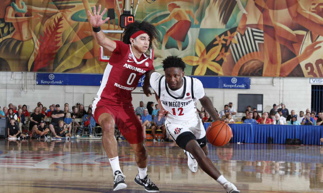 Anthony Black guards San Diego State's Darrion Trammell during a 78-74 overtime win over the Aztecs at the Maui Invitational.
