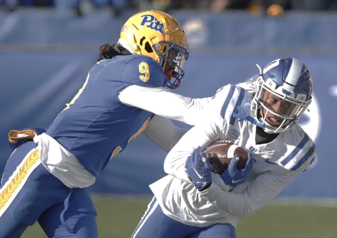Duke's Jordan Moore, right, pulls in a catch against Pittsburgh's Brandon Hill during last season's game. 