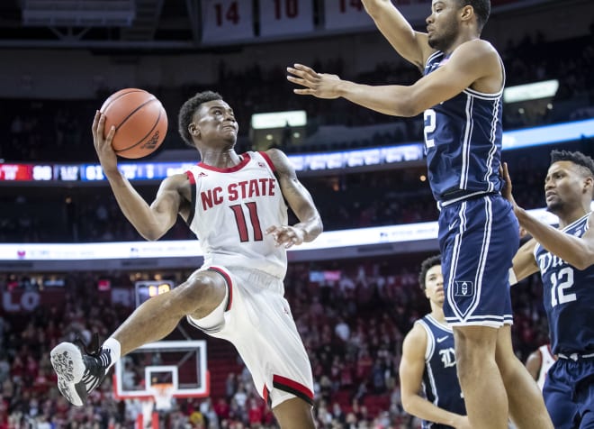 NC State Wolfpack basketball guard Markell Johnson shoots against Duke.