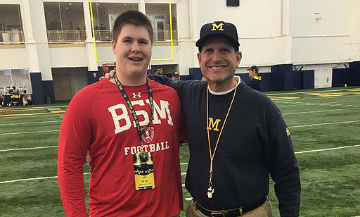 Eric Wilson and Jim Harbaugh after a recent spring practice.
