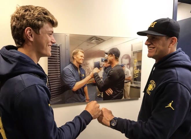 Michigan Wolverines football freshman quarterback J.J. McCarthy with Jim Harbaugh