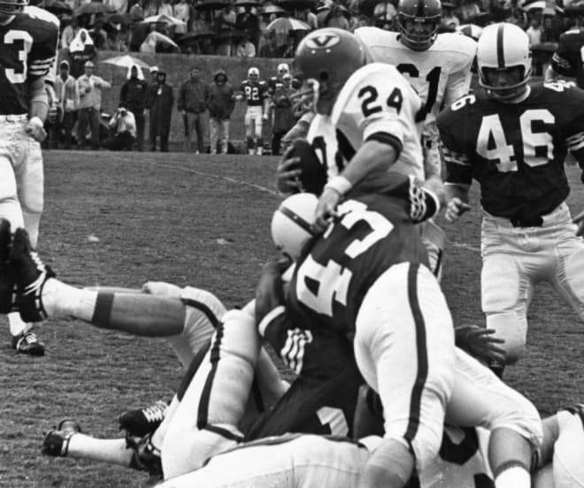 Virginia star running back Frank Quayle was tackled. NC State upset Quayle and Virginia in 1968.