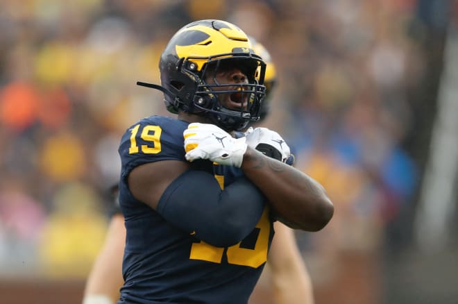 Former Michigan Wolverines football defensive end Kwity Paye was picked by the Indianapolis Colts in the first round of the 2021 NFL Draft.
