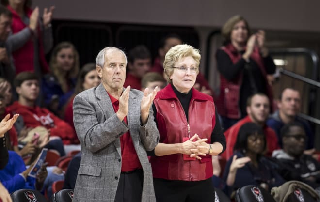 Yow (standing with former NC State basketball star Eddie Biedenbach) was impressed with year one in men's basketball under head coach Kevin Keatts.