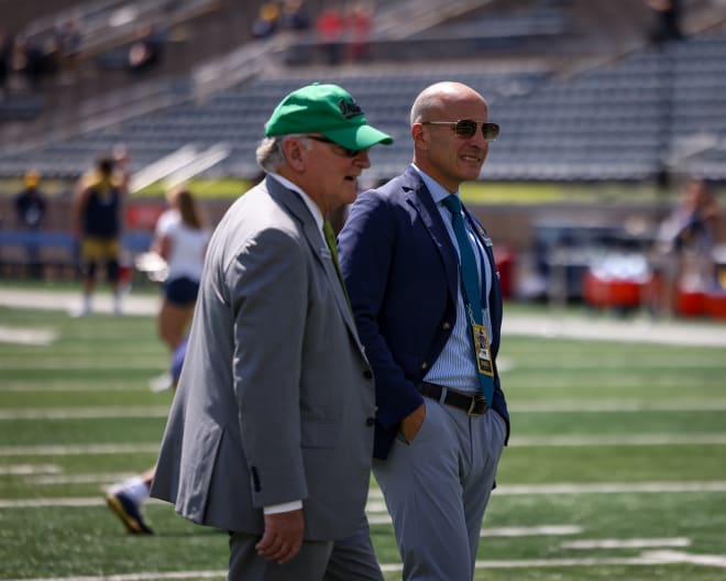 Long-time athletic director Jack Swarbrick (left) handed the keys to the Notre Dame athletic department on March 25 to successor Pete Bevacqua,
