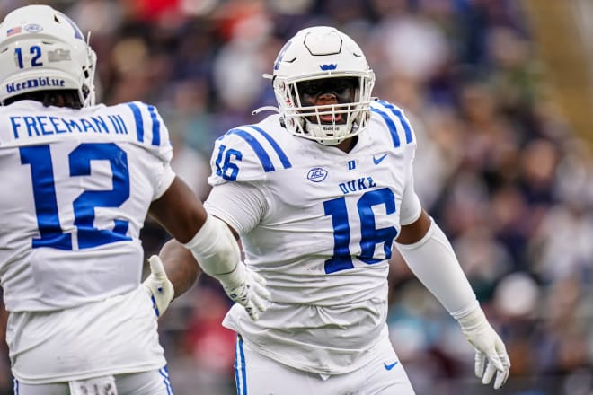 Duke's Aeneas Peebles, right, and Tre Freeman celebrate during Saturday's win over UConn. 