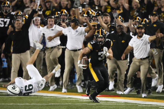 Cooper DeJean returns a punt for a game-winning score against Michigan State at Kinnick Stadium in 2023.