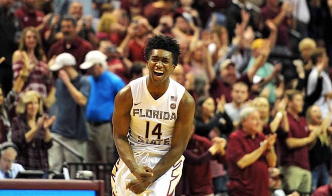 Terance Mann celebrates Florida State's 73-68 win over Louisville on Saturday at the Donald L. Tucker Center.