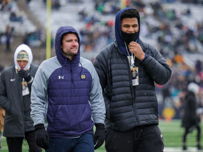 Notre Dame football director of recruiting Chad Bowden, left, has made a big impact in three years with the Irish.