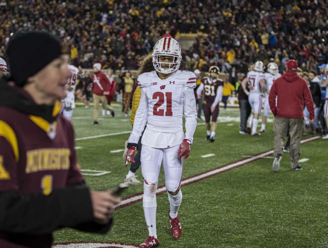 Cornerback Caesar Williams walks off the field after Wisconsin's loss to Minnesota. 