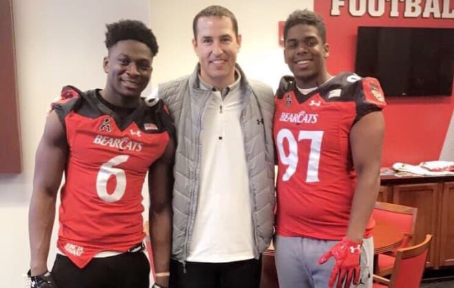 Asamoah and fellow in-state Bearcats target Aeneas Hawkins with Coach Fickell.