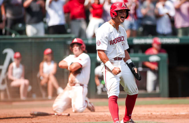 Tavian Josenberger celebrates with Peyton Holt in the background during Arkansas' win over Santa Clara.