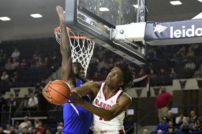 Alabama Crimson Tide guard Herb Jones (10) looks to shot as Memphis Tigers forward Raynere Thornton (4) defends during the second half, in game one of the Veterans Classic at Alumni Hall. Alabama Crimson Tide defeated Memphis Tigers 82-70. Photo | USA Today