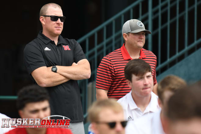 Assistant coach Lance Harvell (left) and head coach Will Bolt (right) watch the NCAA regional selection show. 