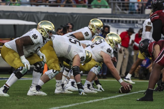 Notre Dame's offensive line moves into the spotlight this spring with a new O-line coach, in Joe Rudolph, and two starting positions up for grabs.