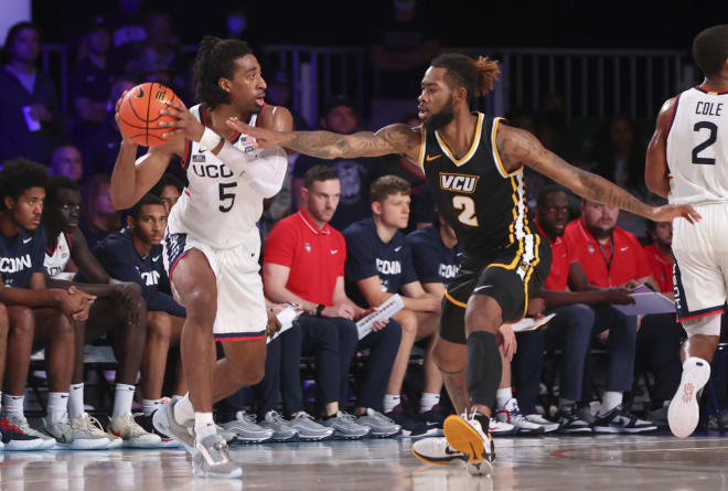 Connecticut Huskies forward Isaiah Whaley (5) looks to pass as Virginia Commonwealth Rams forward Mikeal Brown-Jones (2) defends during the second half at Imperial Arena. Mandatory Credit: Kevin Jairaj-USA TODAY Sports