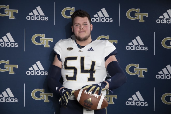 Tate Johnson dons the Georgia Tech uniform for the first time during his visit on Thursday