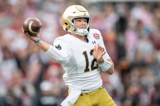 Notre Dame Fighting Irish quarterback Tyler Buchner (12) throws the ball against the South Carolina Gamecocks in the first quarter in the 2022 Gator Bowl at TIAA Bank Field. Photo | Jeremy Reper-USA TODAY Sports