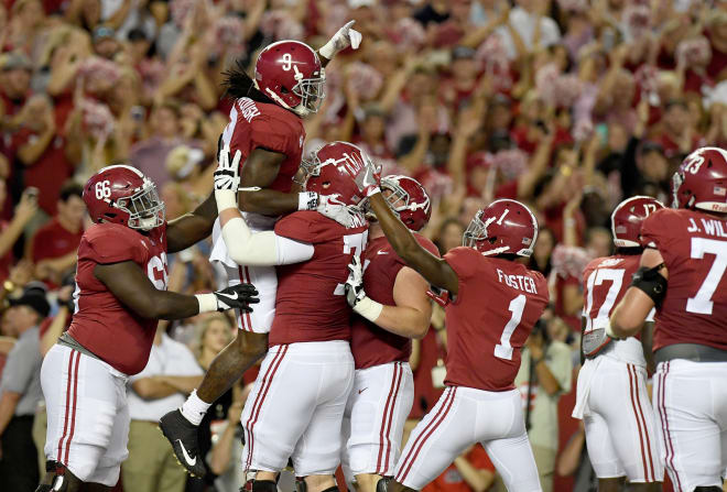 Alabama Crimson Tide running back Bo Scarbrough (9) celebrates his touchdown in the end zone with offensive lineman Matt Womack (77) against the Mississippi Rebels during the first quarter at Bryant-Denny Stadium. Photo | USA Today