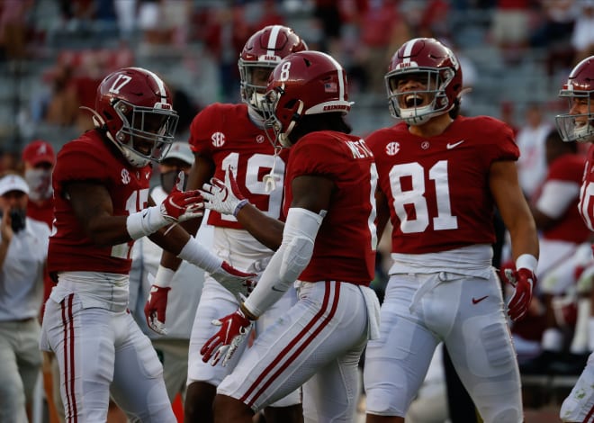 Alabama John Metchie III #8 and Jaylen Waddle #17 of the Alabama Crimson Tide celebrate a touchdown run against the Texas A&M Aggies on October 3, 2020 at Bryant-Denny Stadium in Tuscaloosa, Alabama. Photo | Getty Images