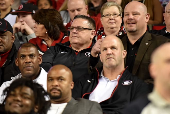 Sam Pittman sits behind Georgia senior associate director of S&C Ed Ellis.