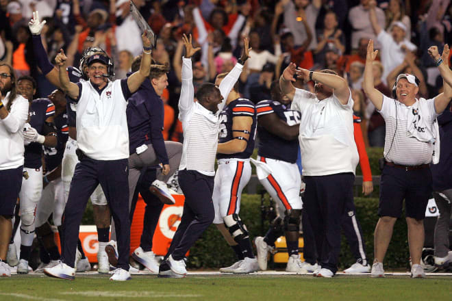 Malzahn and Auburn's sideline celebrate a big fourth-quarter play.