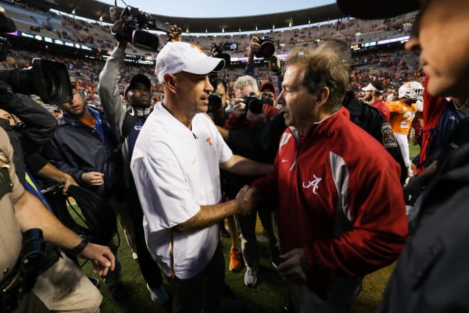 Tennessee head coach Jeremy Pruitt (left) and Alabama head coach Nick Saban shake hands following the 2018 game. Photo | Getty Images 