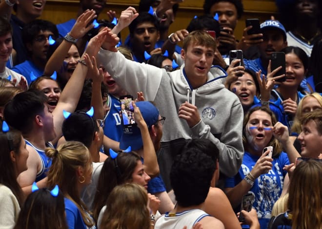 Cooper Flagg, middle right, joins the Cameron Crazies during Friday night's event. 
