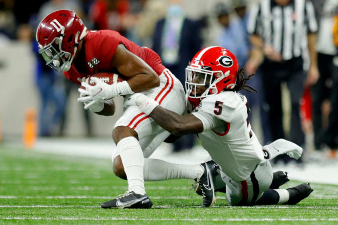 Alabama wide receiver Traeshon Holden (11) tries to escape a tackle during the College Football Playoff National Championship at Lucas Oil Stadium. Photo |  Robert Scheer / USA TODAY NETWORK
