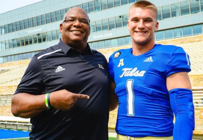 Bergin Kysar with Tulsa DL coach Ron Burton in May.