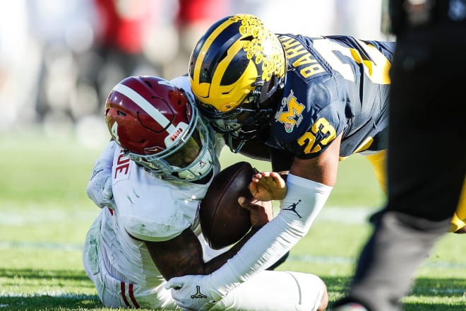 Michigan linebacker Michael Barrett tackles Alabama quarterback Jalen Milroe during the first half of the Rose Bowl in Pasadena, California, on Monday, Jan. 1, 2024. Photo | Junfu Han / USA TODAY NETWORK