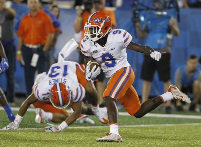 Sep 23, 2017; Lexington, KY, USA; Florida Gators wide receiver Dre Massey (9) runs the ball against the Kentucky Wildcats In the second half at Commonwealth Stadium. Florida defeated Kentucky 28-27. 