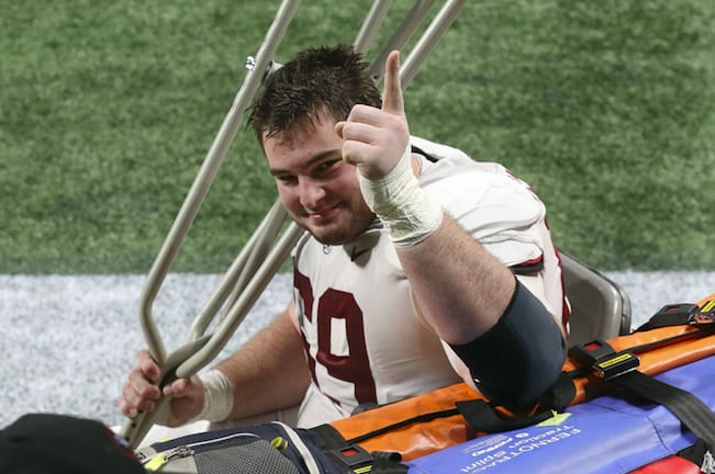 Alabama offensive lineman Landon Dickerson (69) injured near the end of Alabama's 52-46 victory in the SEC Championship Game, celebrates from a medical cart at Mercedes-Benz Stadium. Photo | Imagn