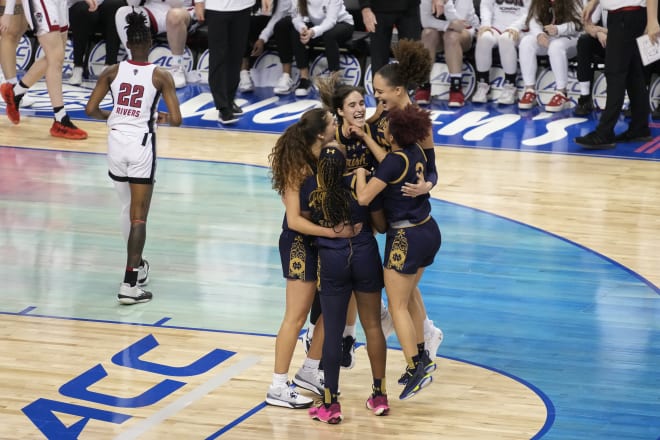 Notre Dame's players celebrate an ACC Tourney title March 10 as the final seconds tick off in a 55-51 win over NC State.