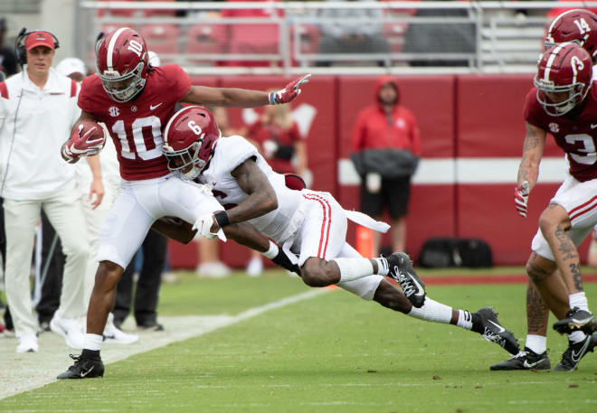 Crimson wide receiver JoJo Earle (10) is driven out of bounds by White defensive back Khyree Jackson (6) during the A-Day game at Bryant-Denny Stadium.  Photo |  Gary Cosby Jr.-USA TODAY Sports