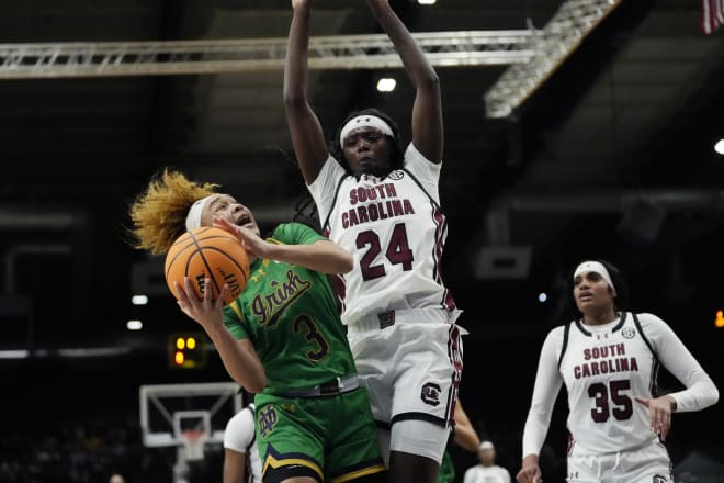 Notre Dame freshman Hannah Hidalgo (3) tries to get off a shot against South Carolina's Sahnya Jah (24).