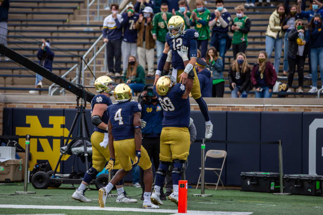 Notre Dame and quarterback Ian Book (12) are still searching for passing-game steadiness.