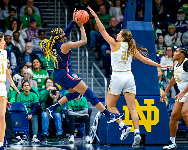 Maddy Westbeld (21) helped lead a strong defensive effort by Notre Dame against Aaliyah Edwards (3) and UConn.