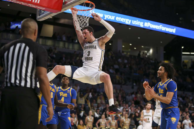 Cole slams home a dunk against Pitt