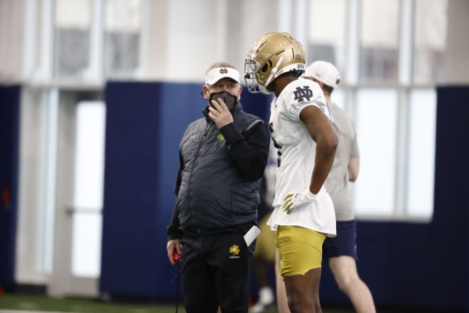 Notre Dame Fighting Irish football head coach Brian Kelly and junior cornerback Cam Hart