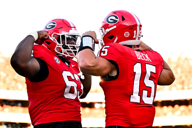 Georgia offensive lineman Sedrick Van Pran (63) and Georgia quarterback Carson Beck (15) calebrate after a touchdown during a game against UT Martin on Dooley Field at Sanford Stadium in Athens, Ga., on Saturday, September 2, 2023. (photo by Rob Davis/UGA Sports Communications)