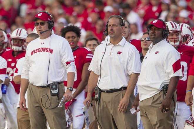 Head coach Paul Chryst (left), OC Joe Rudolph (center) and RB coach John Settle coach during a 2016 home game.