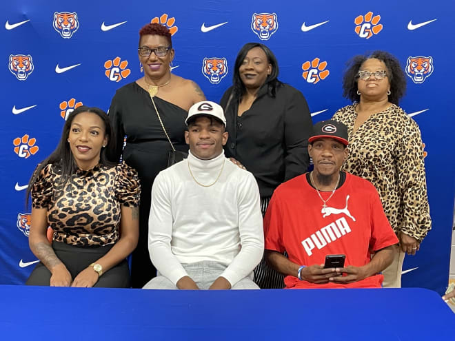 Demarcus Riddick with his family after committing to Georgia. Photo by Jed May.