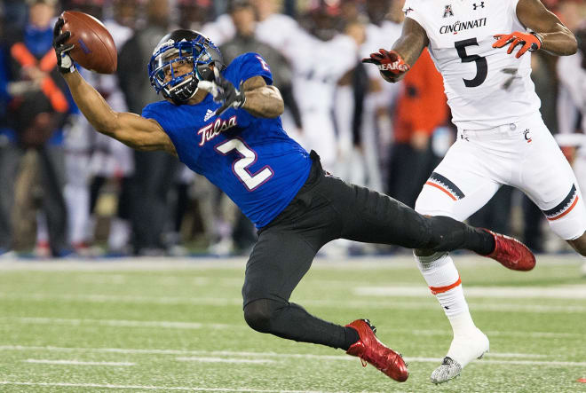 Keevan Lucas' 47-yard one-handed diving catch was one of many highlights in Tulsa's 40-37 overtime victory over Cincinnati on senior night.