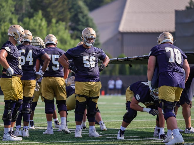 Notre Dame freshman offensive tackle Charles Jagusah (56) has come a long way since his first practices in July.