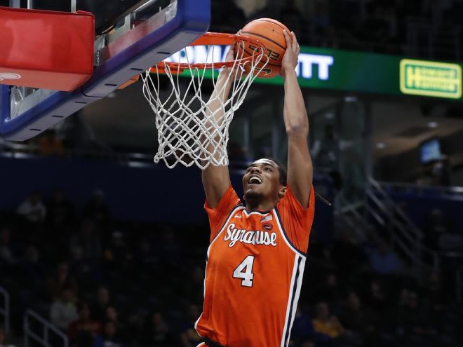 Jan 16, 2024; Pittsburgh, Pennsylvania, USA; Syracuse Orange forward Chris Bell (4) dunks the ball on a breakaway against the Pittsburgh Panthers during the first half at the Petersen Events Center. Mandatory Credit: Charles LeClaire-USA TODAY Sports