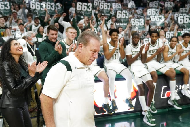 Players and fans salute Tom Izzo on March 6, 2022 after he recorded his 663rd victory at Michigan State, surpassing Bob Knight's record for wins by a coach at a single Big Ten school.