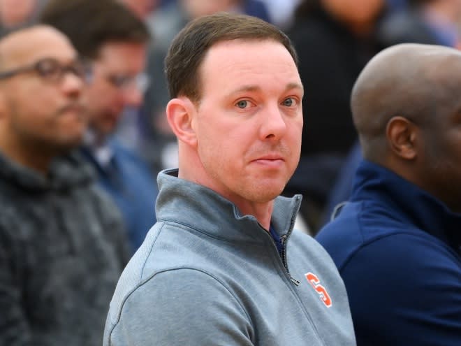 Mar 10, 2023; Syracuse, New York, USA; Syracuse Orange assistant coach Gerry McNamara (left) looks on prior to a press conference at the Carmelo K. Anthony Basketball Center. Mandatory Credit: Rich Barnes-USA TODAY Sports