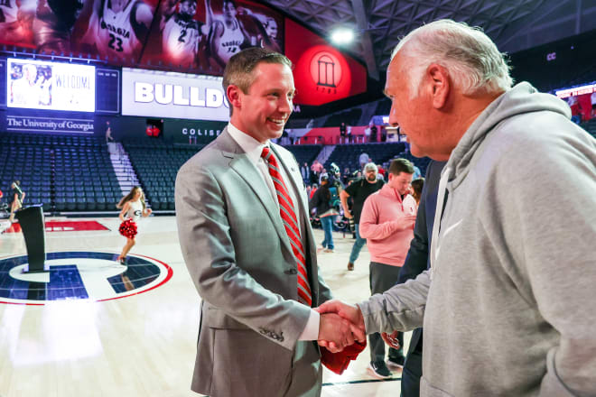 Mike White receives his introction to former Georgia football coach Jim Donnan.