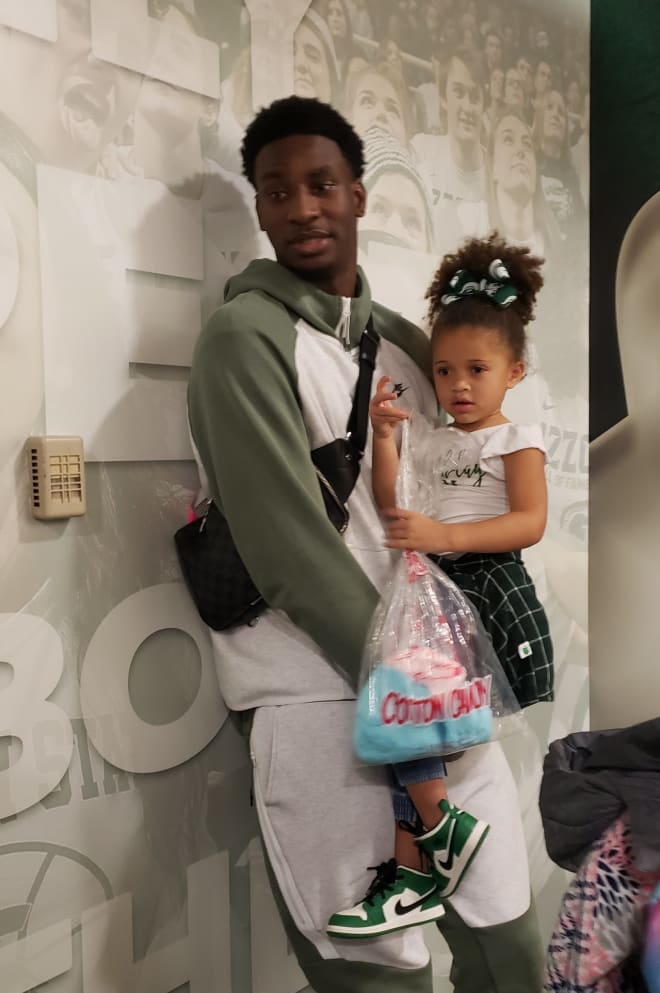 Jaren Jackson Jr. hanging with Xavier Tillman's daughter after Michigan State's basketball game on Dec. 3, 2019, at the Breslin Center in East Lansing, MI. Photo: David Harns/Spartans Illustrated.